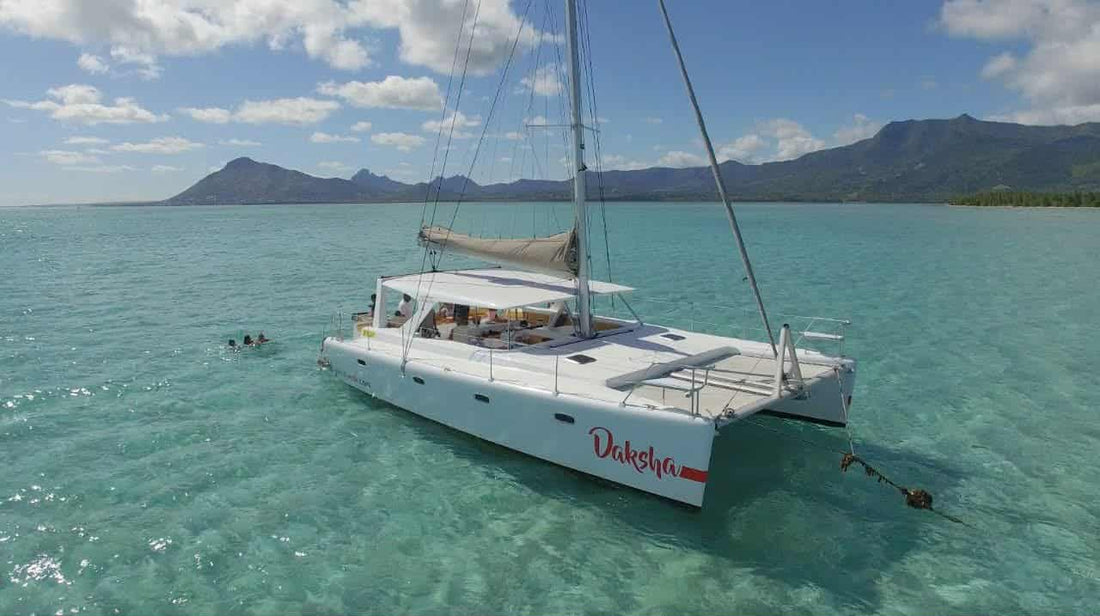 Sunset catamaran cruise in Mauritius with guests enjoying a premium Australian wine tasting experience and gourmet canapés, curated by Audacity Wines.